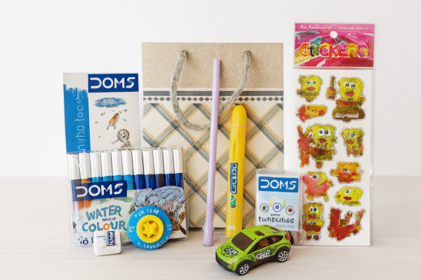 Kids Birthday Return Gift Combo | Coloring Book, Crayons, Sketch Pens, Stickers, Toy Car & Gift Bag - Image 1